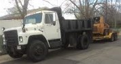 Perfection Hauling dump truck with trailer and loader